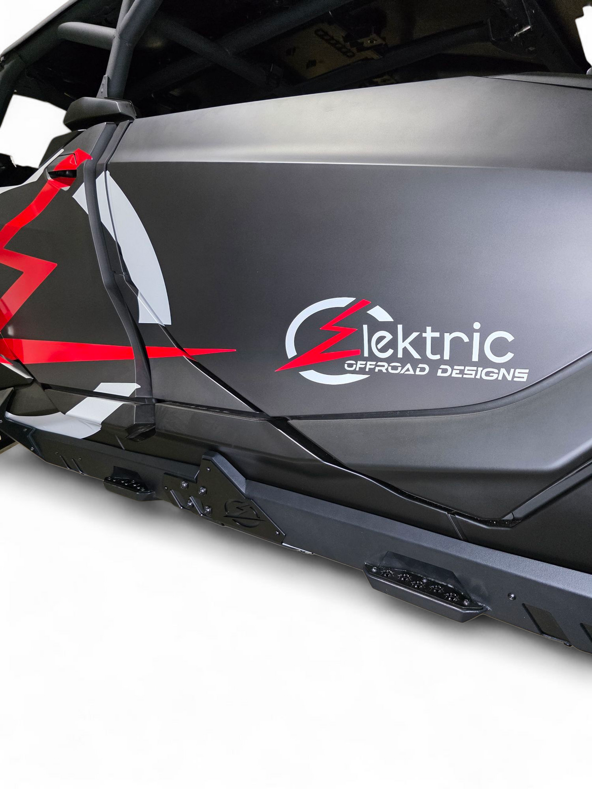 Side profile of Can-Am Maverick R 4-seat Volt Rocker Steps showing full-length rocker panel coverage
