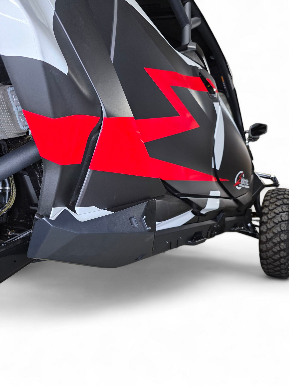 Built-in step with grip plating detail on Can-Am Maverick R Volt Rocker Steps for traction