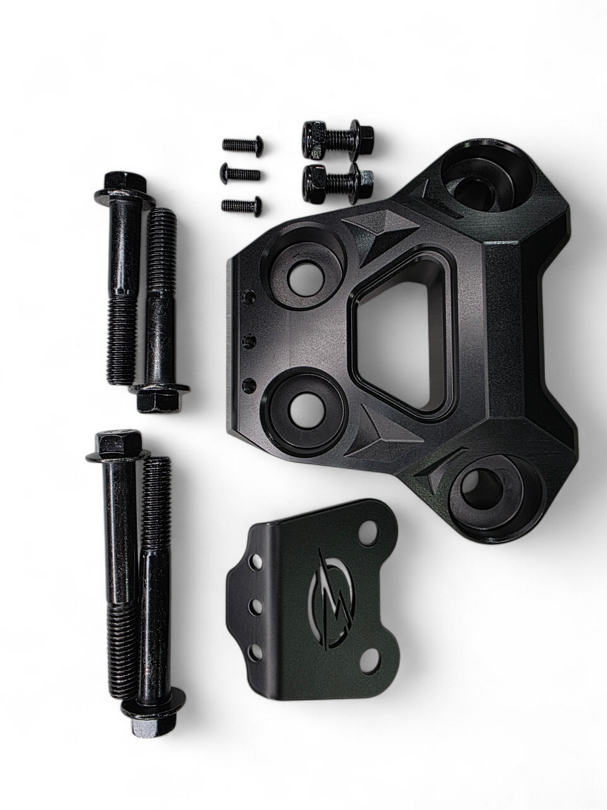 Black anodized billet radius rod plate installed on Can-Am Maverick R protecting rear suspension heim joints