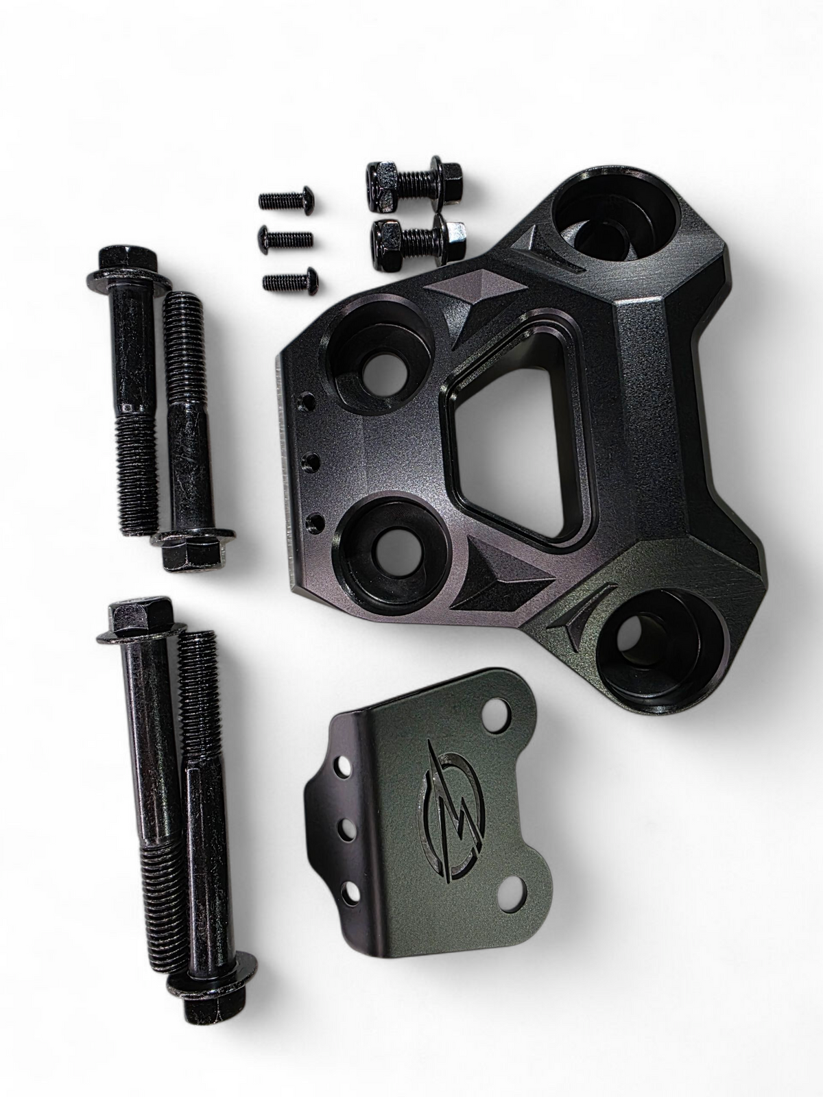Rear suspension reinforcement detail on Can-Am Maverick R black billet radius rod plate