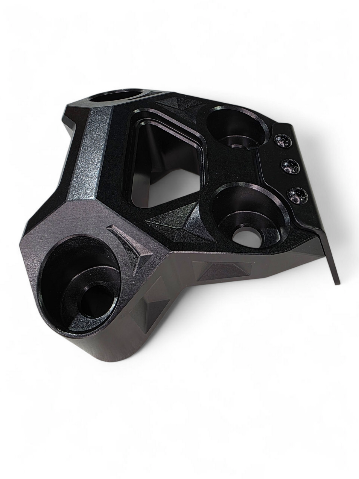 Rear suspension reinforcement detail on Can-Am Maverick R black billet radius rod plate