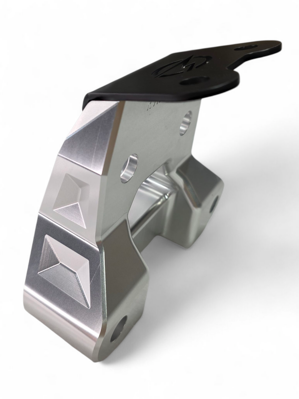 Built-in tow hook detail on Can-Am Maverick R clear billet radius rod plate for recovery