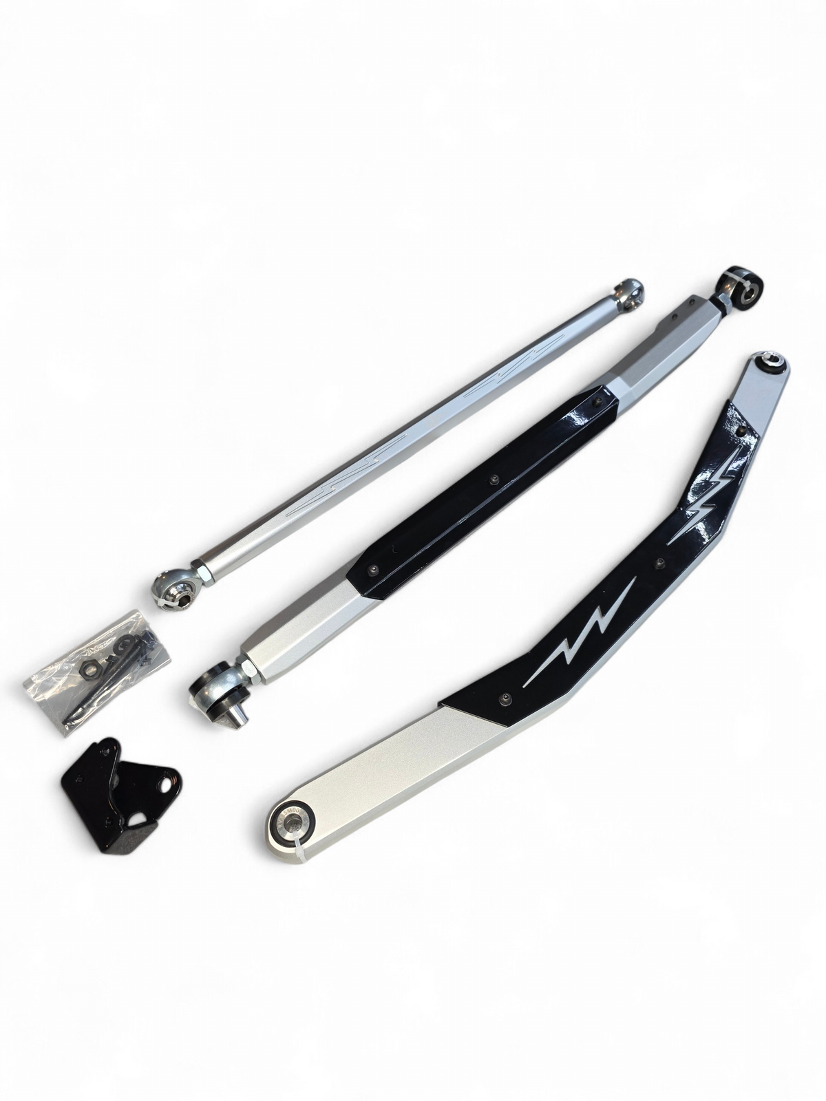 Double shear middle link spindle mount detail on Can-Am Maverick R radius rod showing dual contact point design for maximum strength