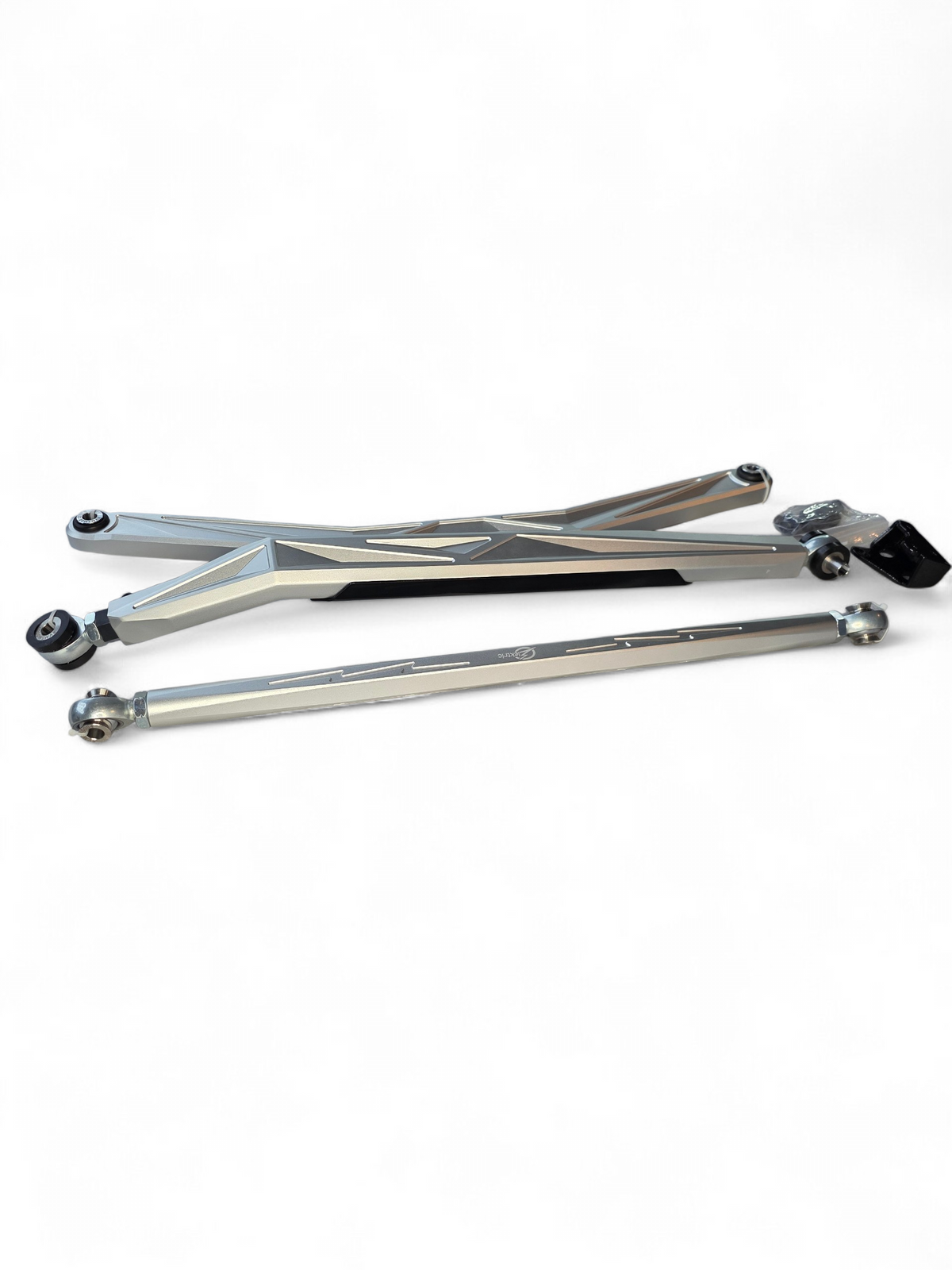 Adjustable radius rods installed on 2024+ Can-Am Maverick R showing geometry adjustment range for toe and alignment tuning