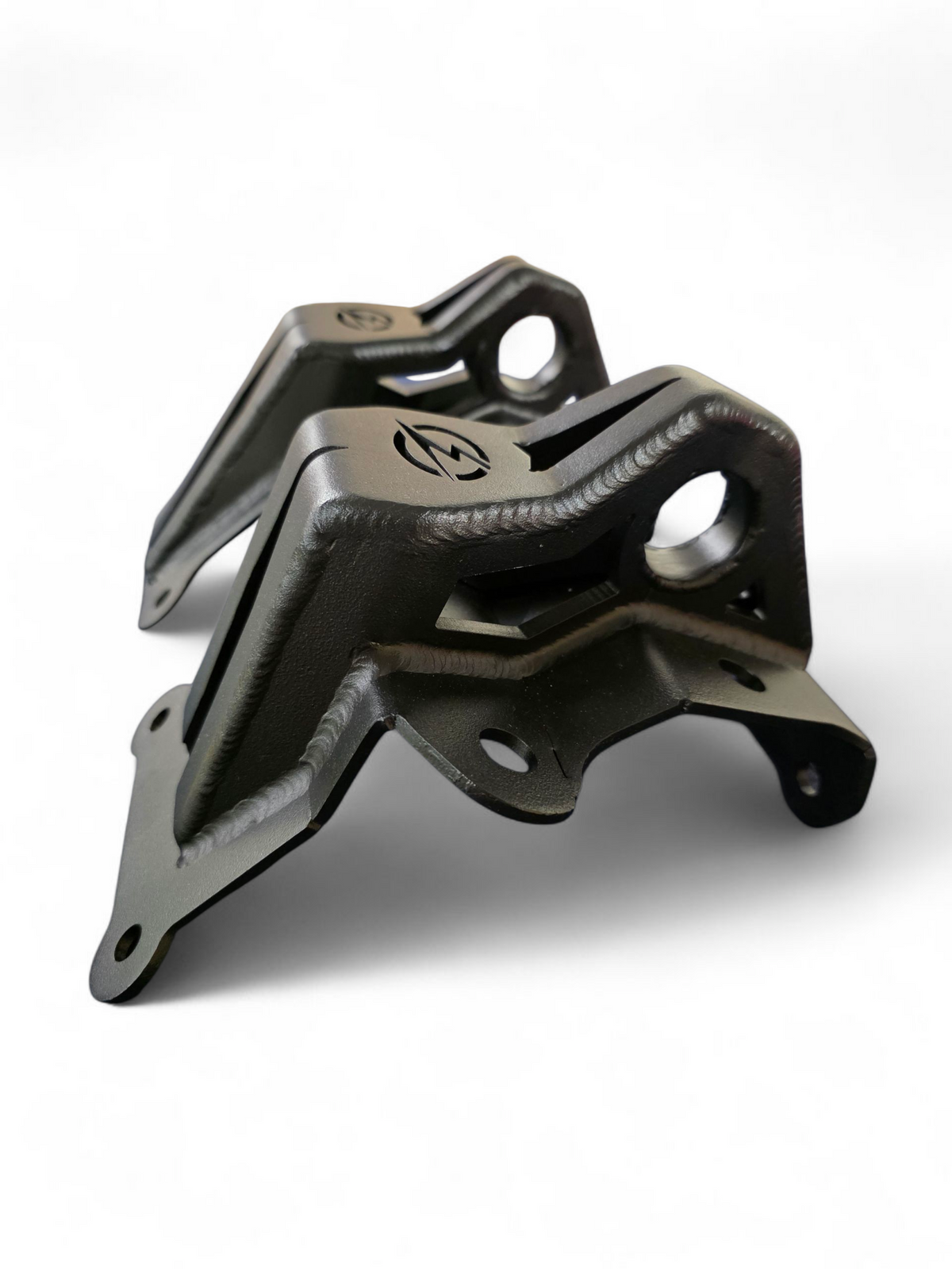 Built-in tow hook detail on Can-Am Maverick R steel radius rod plate for recovery