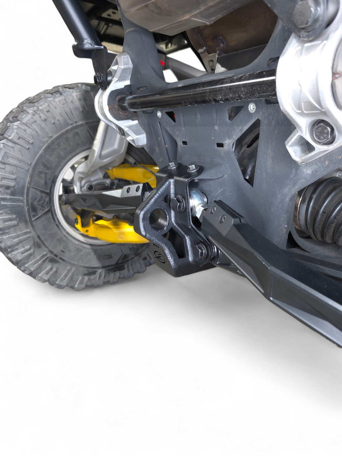Side view of Can-Am Maverick R sheet metal radius rod plate installed