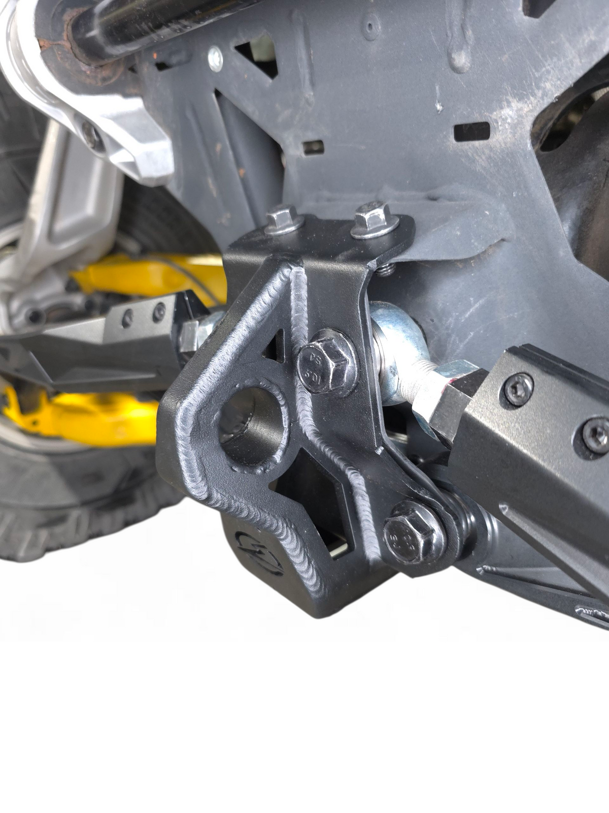 Can-Am Maverick R steel radius rod plate shown protecting radius rod assembly