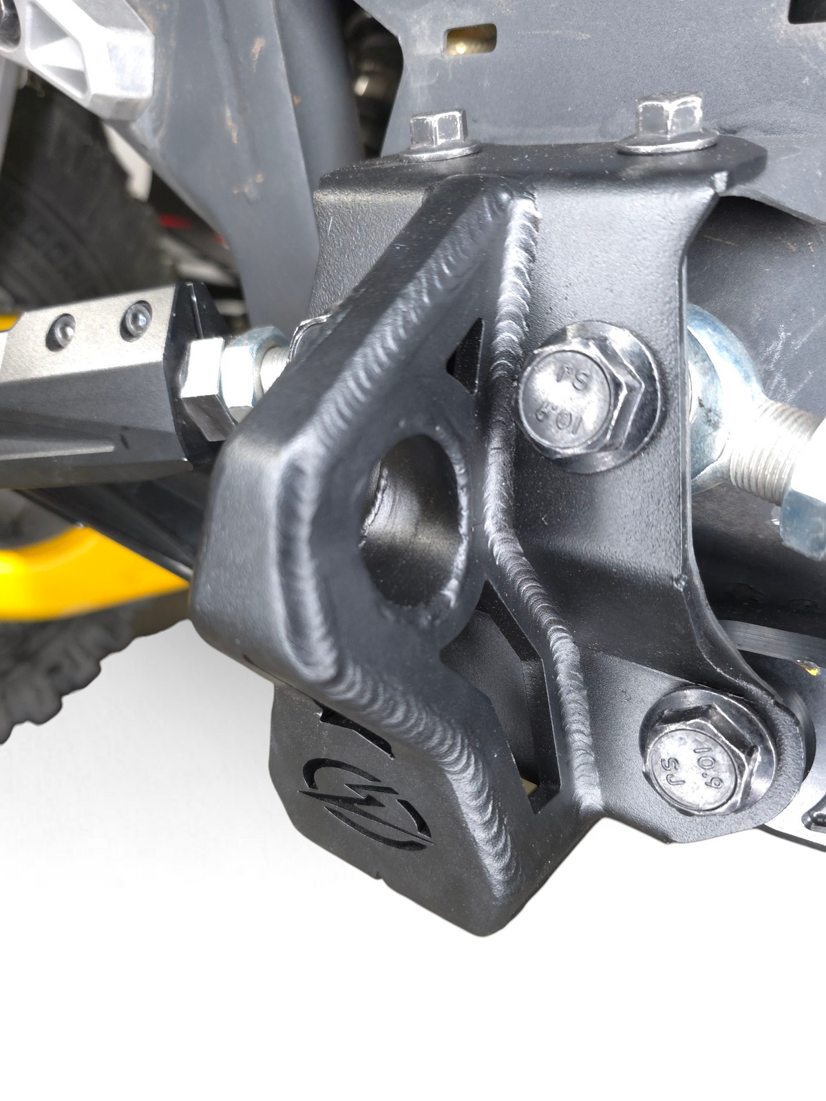 Installed sheet metal radius rod plate on 4-seat Can-Am Maverick R showing fitment