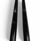 Close-up of an anodized black billet aluminum tie rod for the Can-Am Maverick R showing the CNC-machined surface