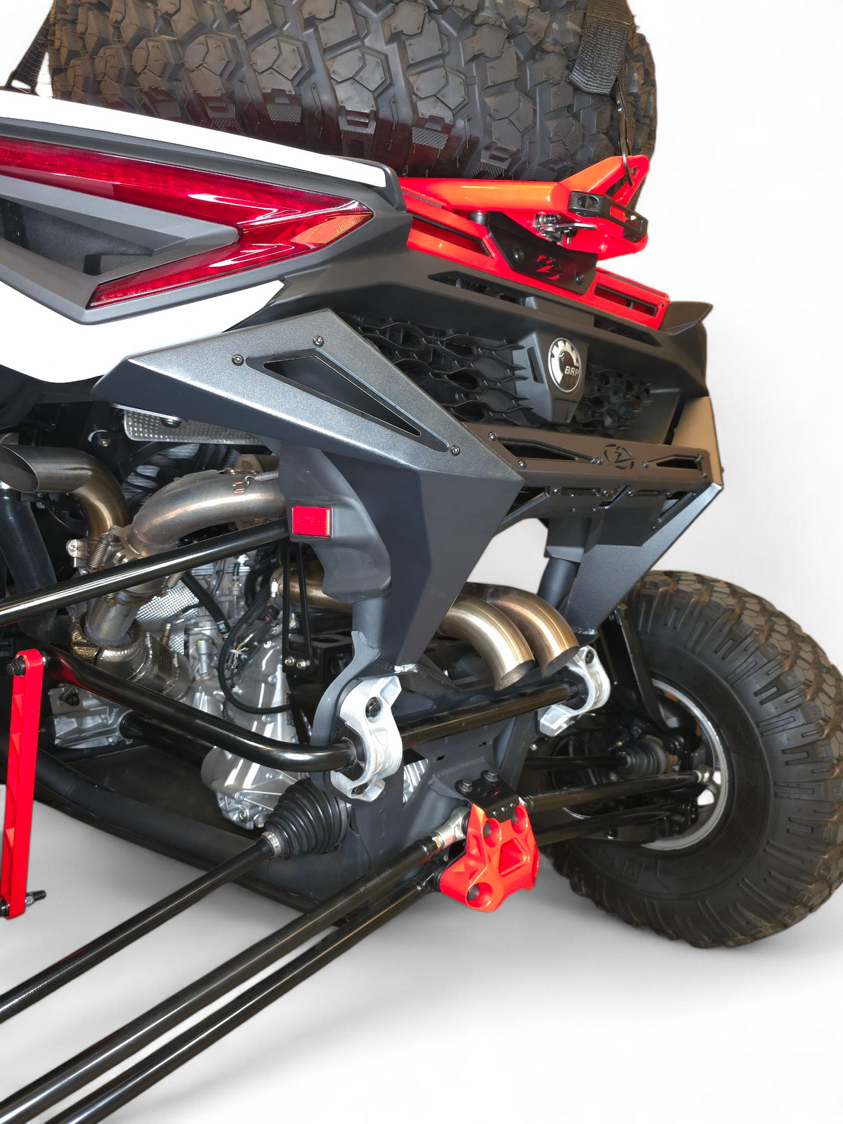 Driver's side rear quarter angle of 2024–2026 Can-Am Maverick R Max showing Volt Rear Bumper flush fitment along the full width of the 4-seat chassis
