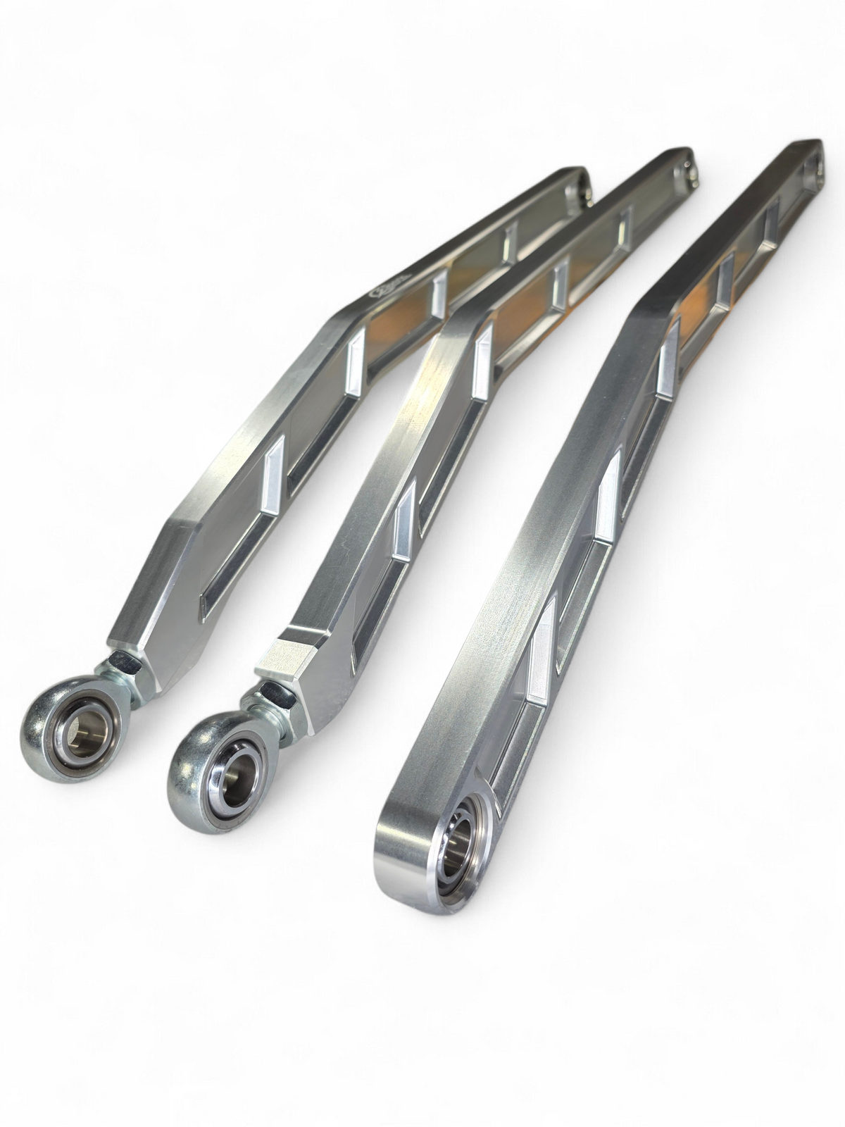 High clearance raised design of Can-Am Maverick X3 clear anodized billet radius rods showing ground clearance gain