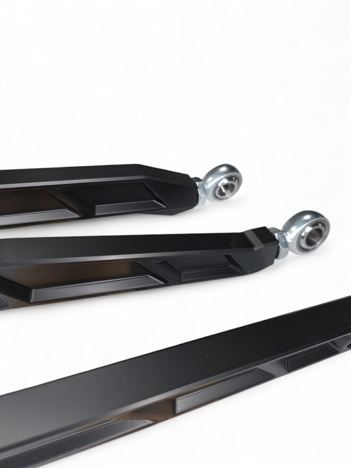 Uniball joint detail on Can-Am Maverick X3 anodized black billet radius rod showing articulation end