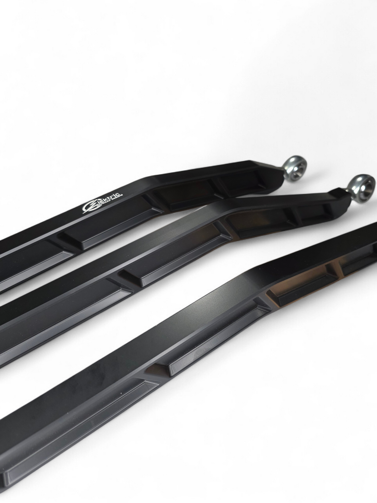 High clearance raised design of Can-Am Maverick X3 billet radius rods showing ground clearance gain