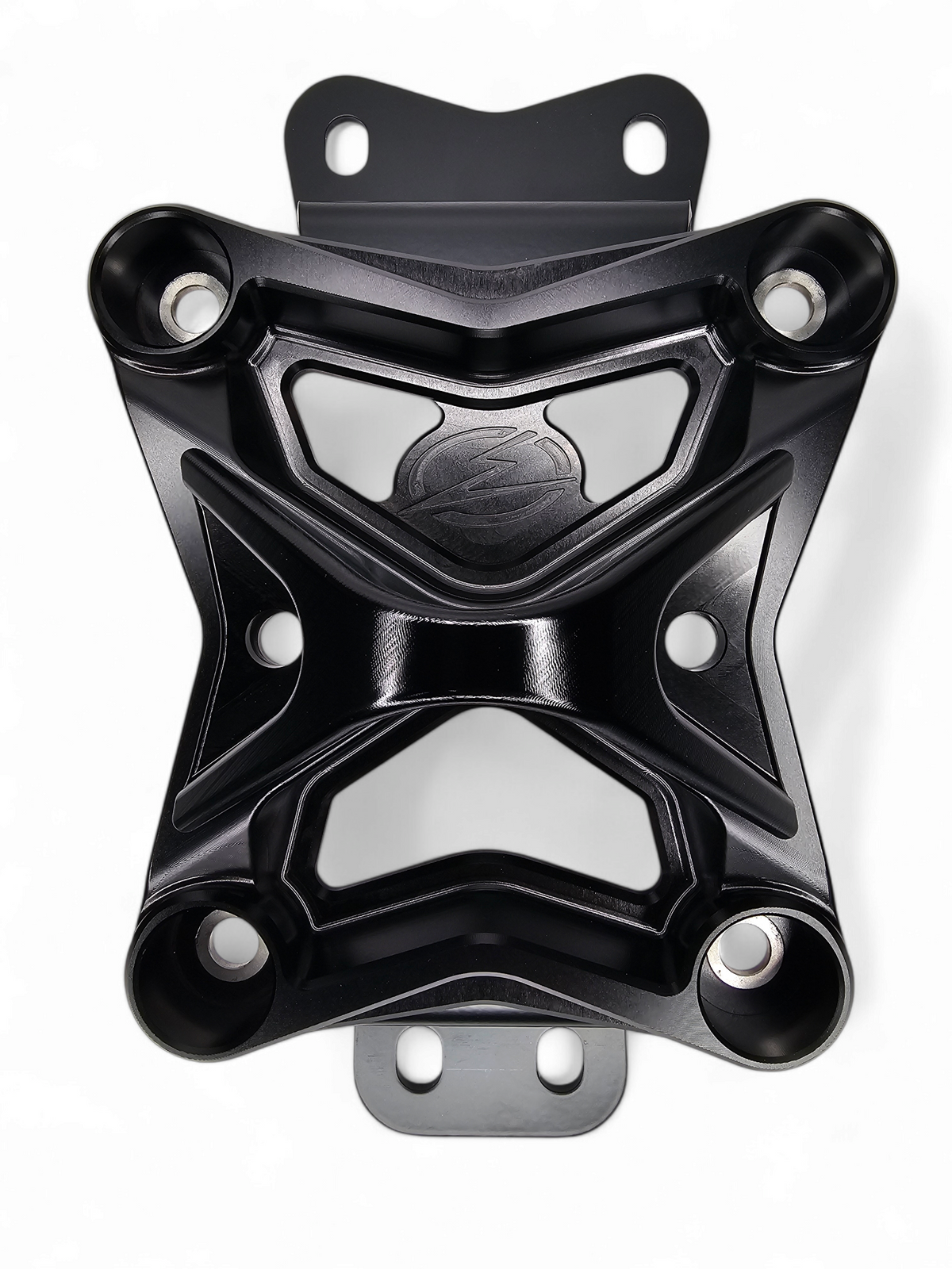 Black anodized 10-bolt radius rod plate installed on Can-Am Maverick X3 protecting rear suspension heim joints