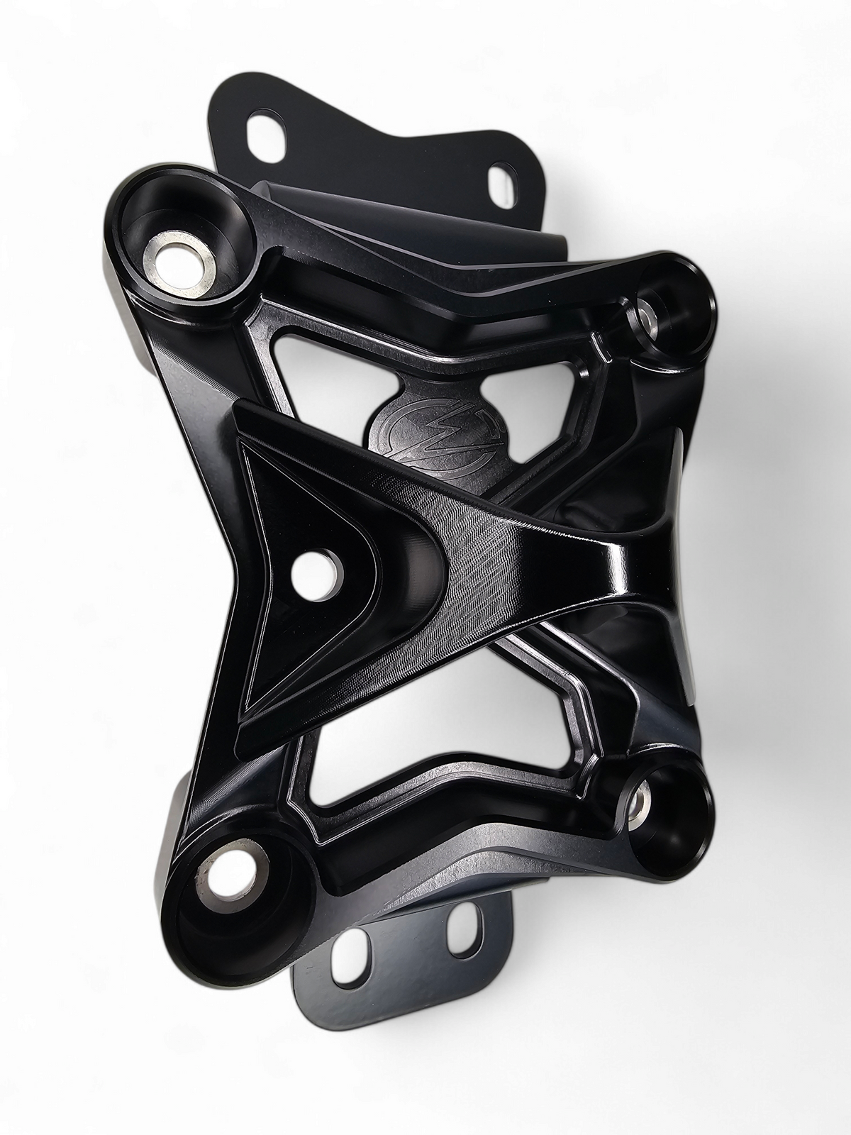 Built-in tow hook detail on Can-Am Maverick X3 black 10-bolt radius rod plate for recovery
