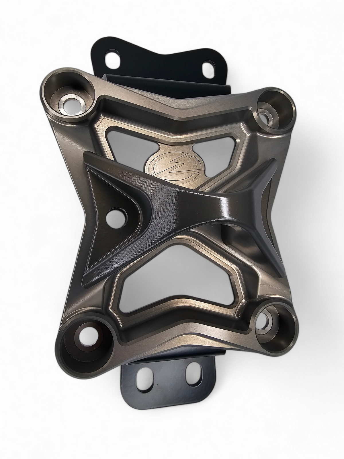 Gun metal anodized 10-bolt radius rod plate installed on Can-Am Maverick X3 protecting rear suspension heim joints