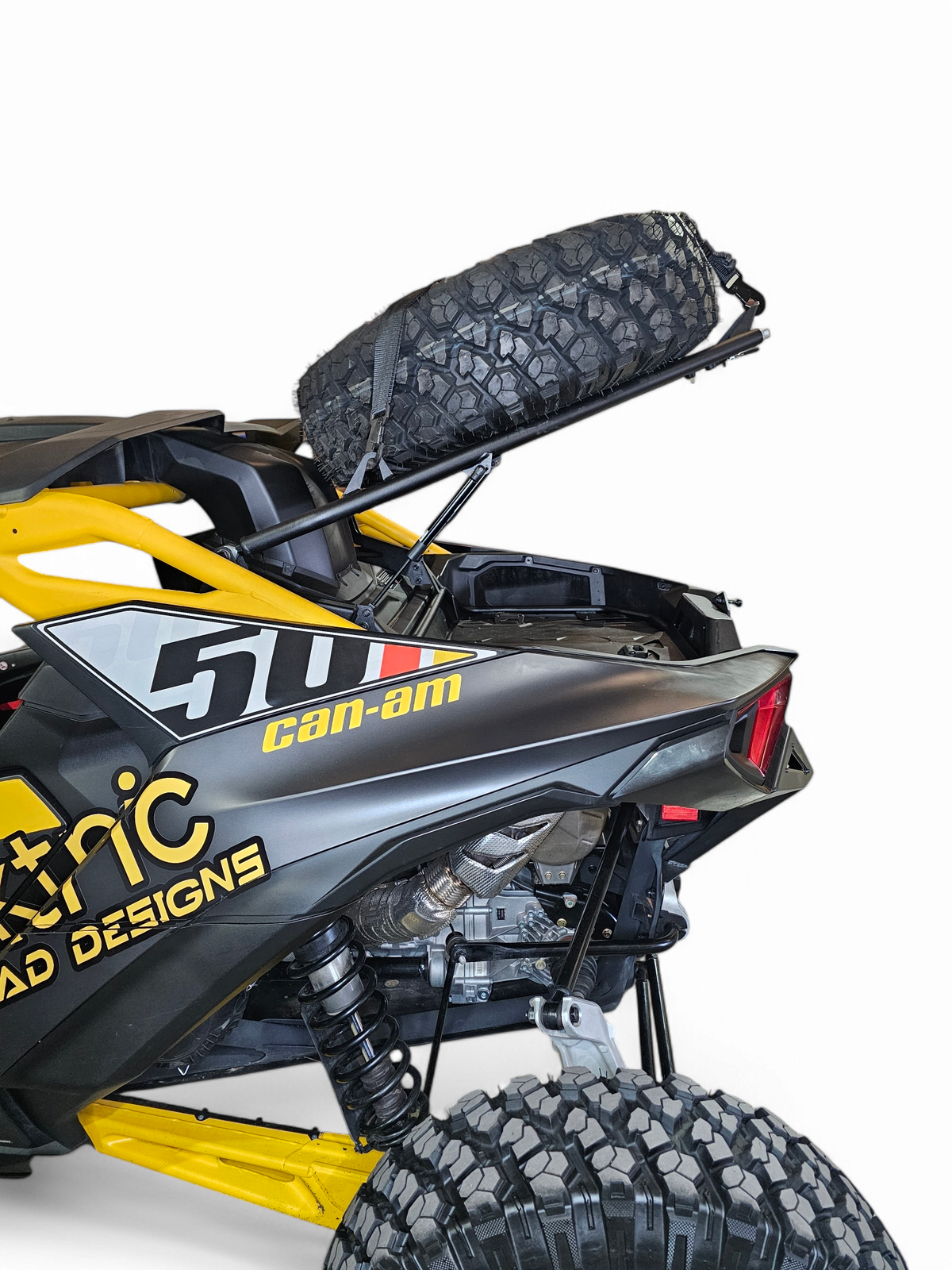 EOD Volt Tire Rack on Can-Am Maverick R with lid open showing underneath storage area for tools and cooling products