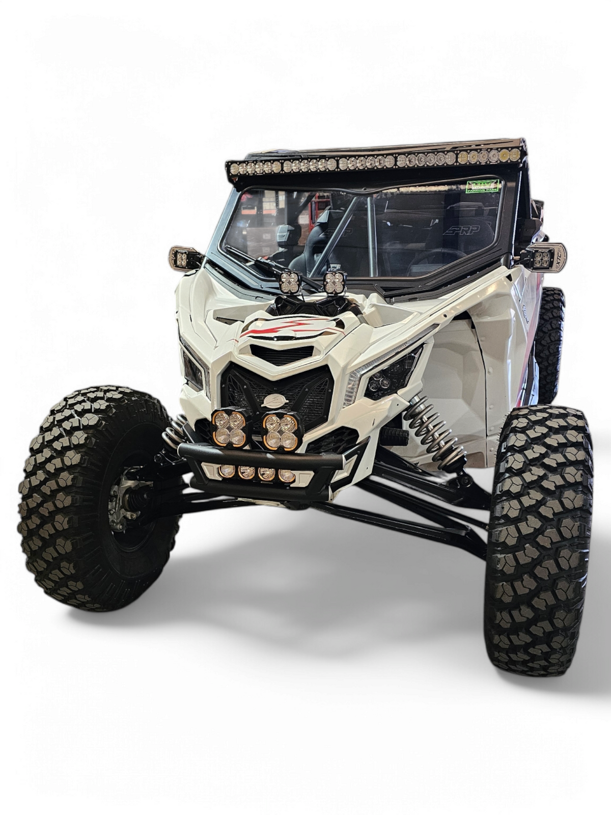 Driver side view of Amp front bumper installed on Can-Am Maverick X3