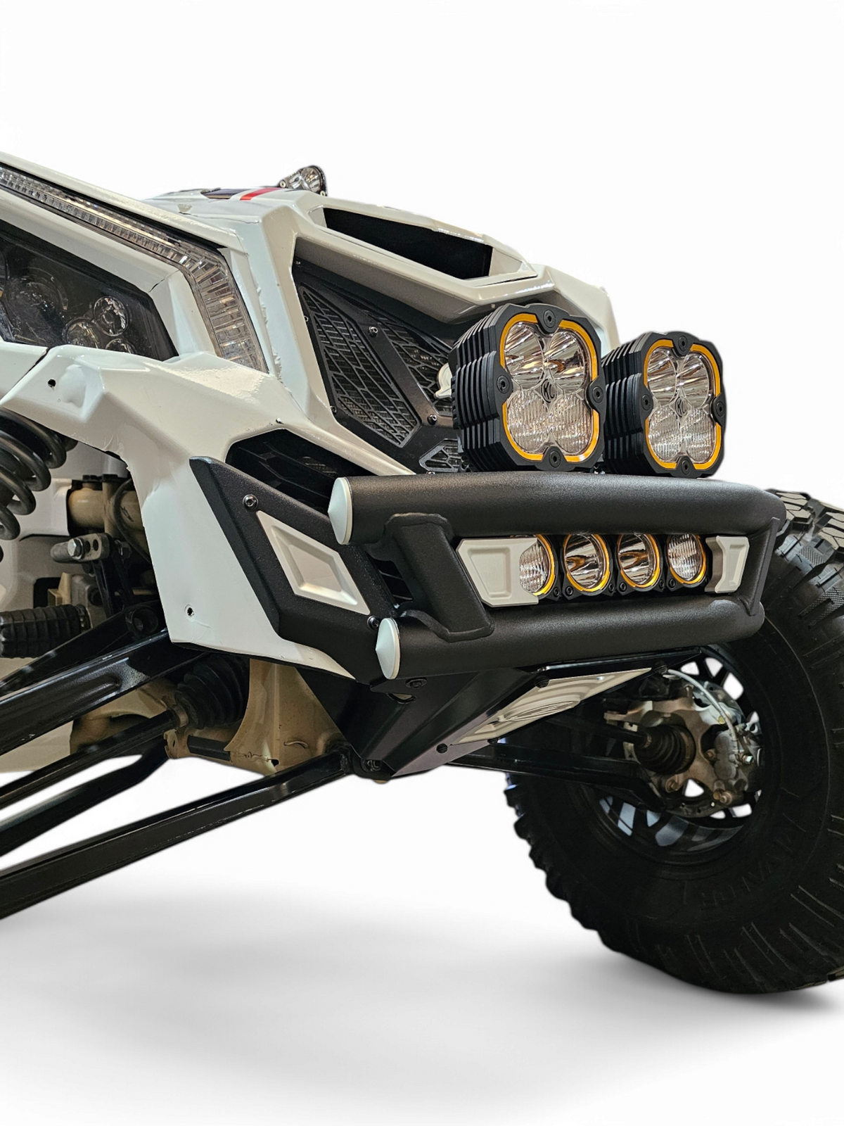 Full machine front view of Can-Am Maverick X3 with Amp front bumper and aggressive dune stance