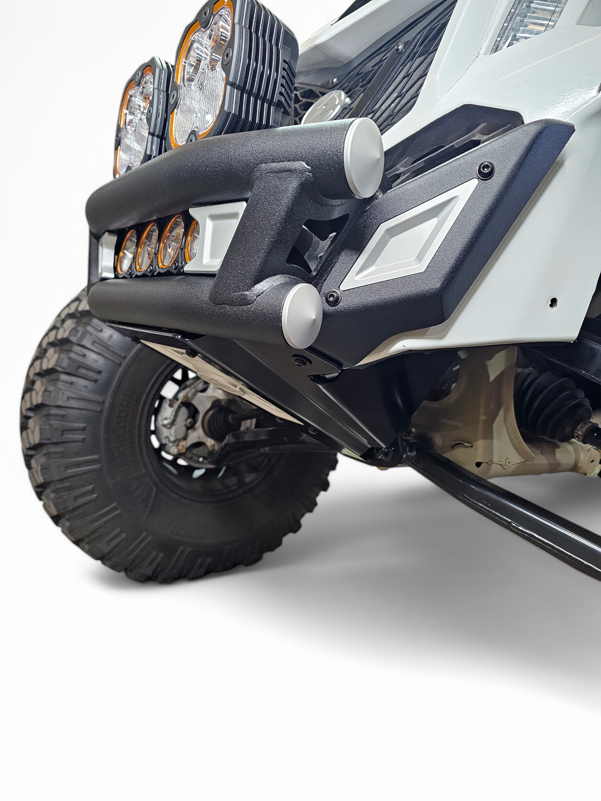 Tubing and sheet metal junction detail on Can-Am Maverick X3 Amp front bumper showing mixed-material build