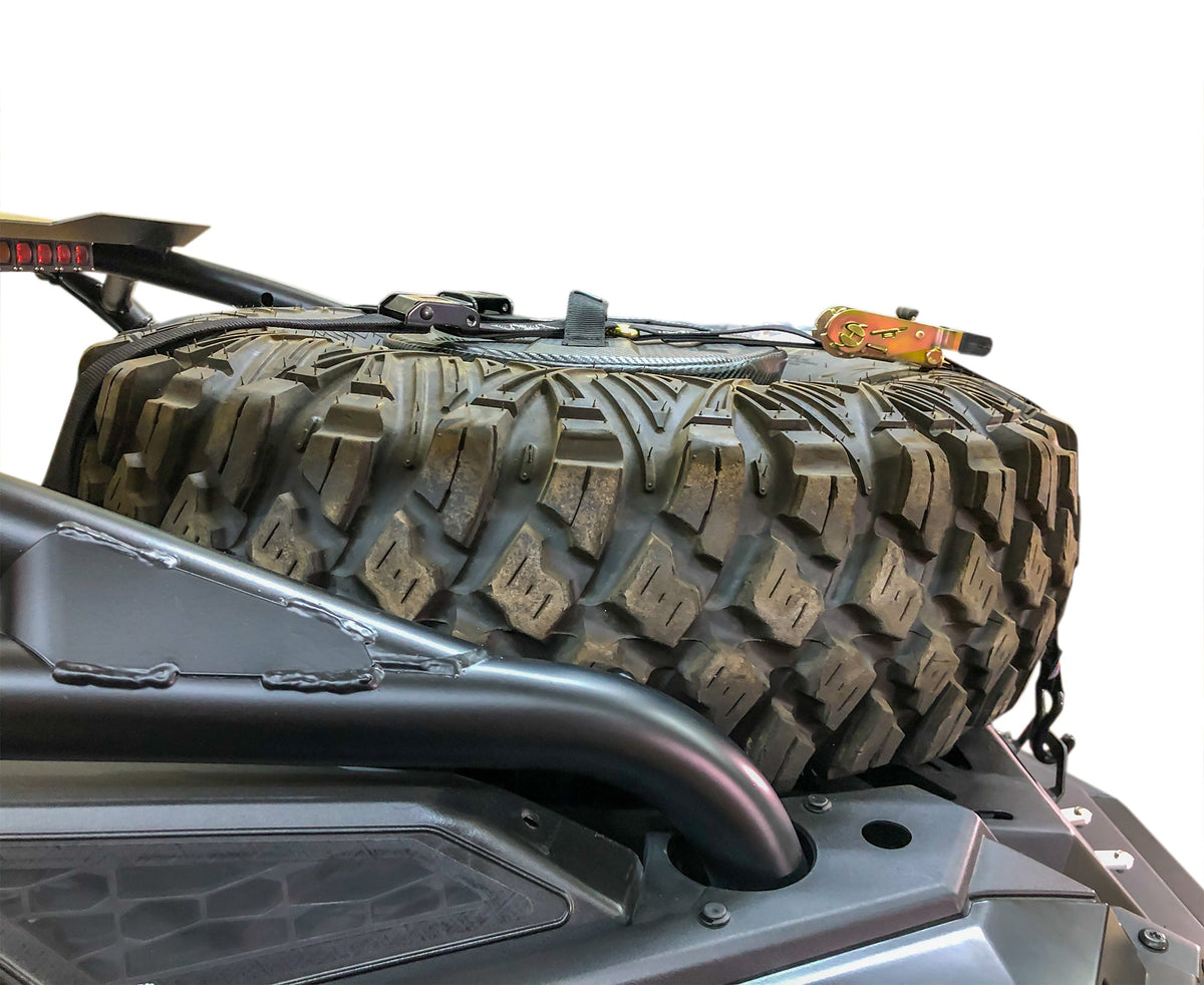 Spare tire storage bag sitting inside inverted off road wheel