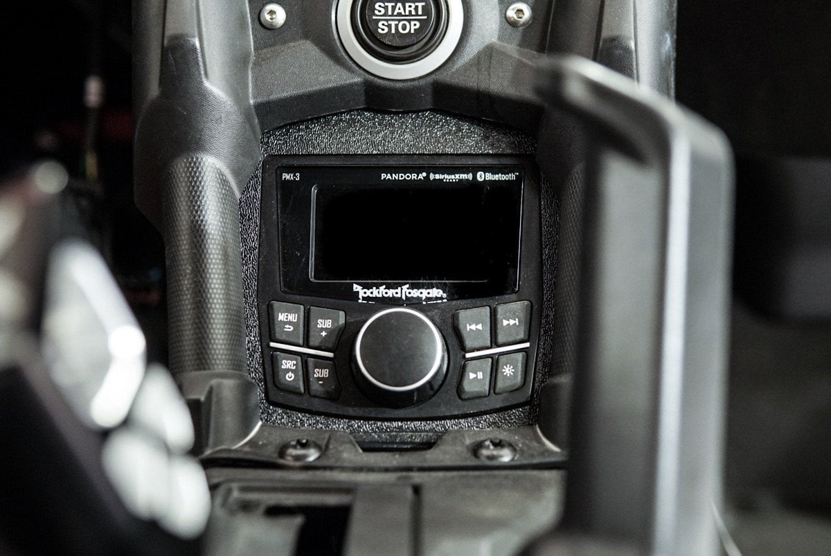 Rockford Fosgate PMX-3 digital media receiver installed in a vehicle dashboard
