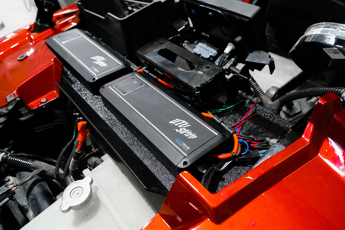 UTV Stereo digital amplifiers installed in a vehicle engine bay