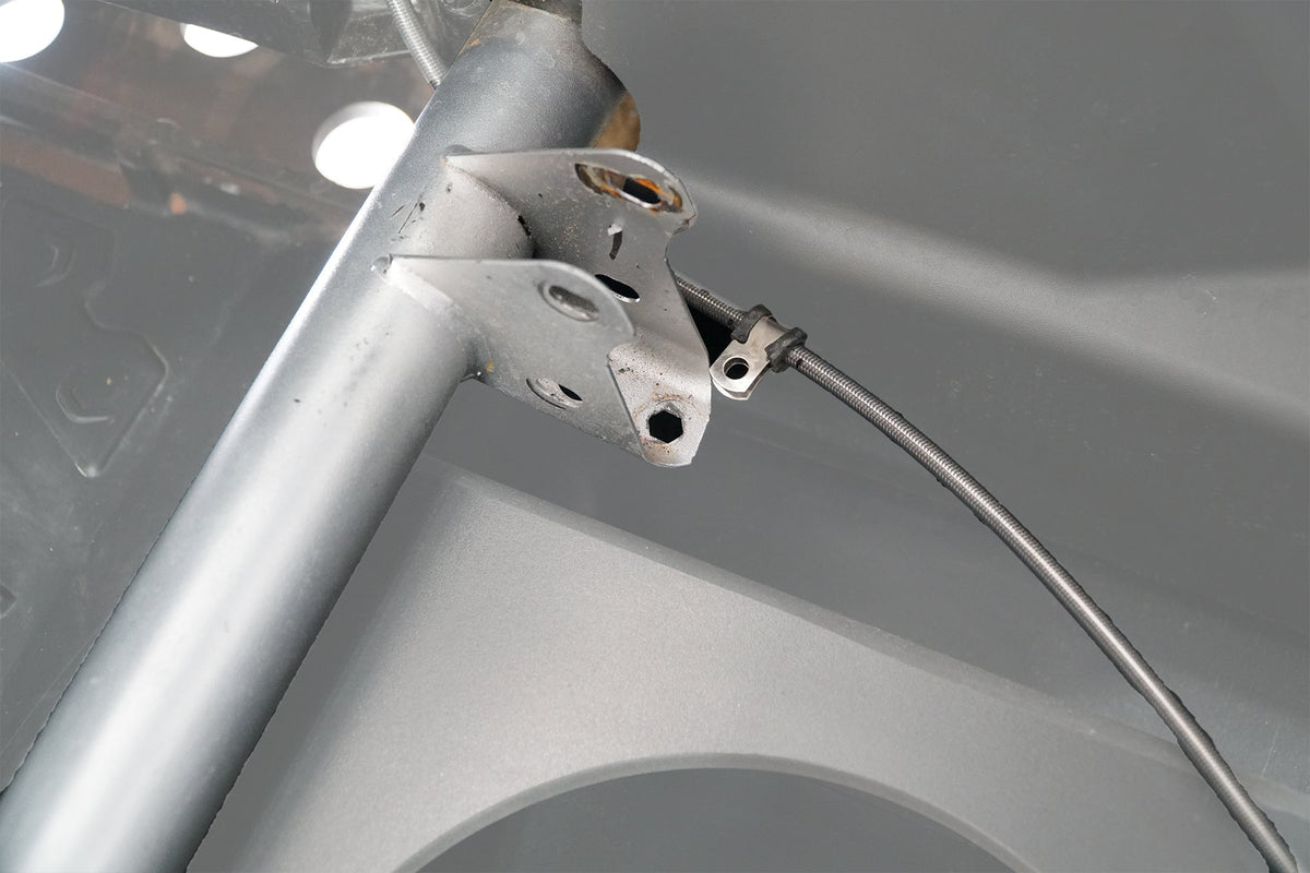 UTV Stereo metal mounting bracket attached to vehicle roll cage frame