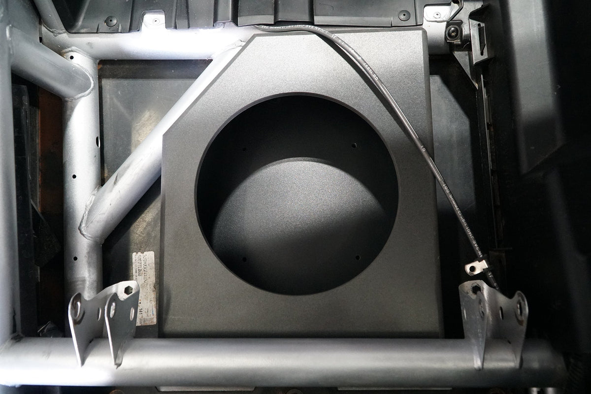 UTV Stereo subwoofer enclosure mounted in vehicle frame