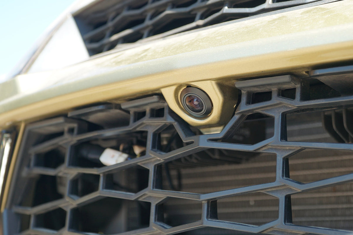 Front facing vehicle camera mounted on the honeycomb grille