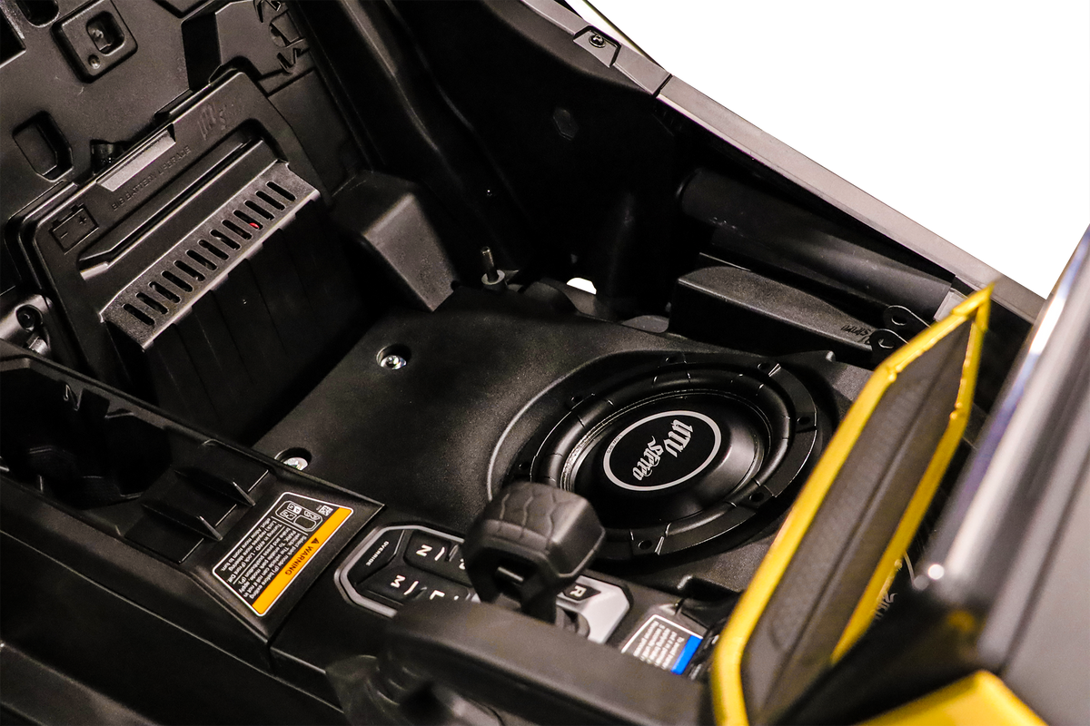 UTV Stereo subwoofer installed in a vehicle center console