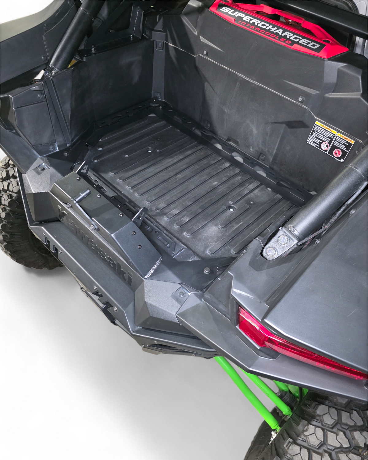 Back of a vehicle with a black floor mat on a white background