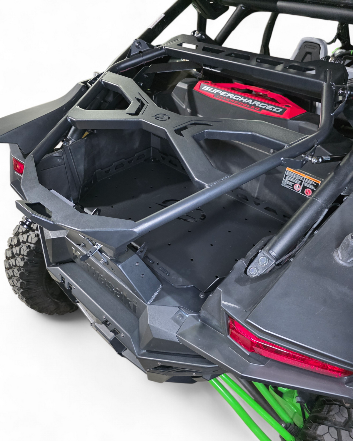 Close-up of a off-road vehicle with an open door, showing interior and branding.