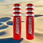 Two red bases with white stripes and Marshin whips branding on a beach