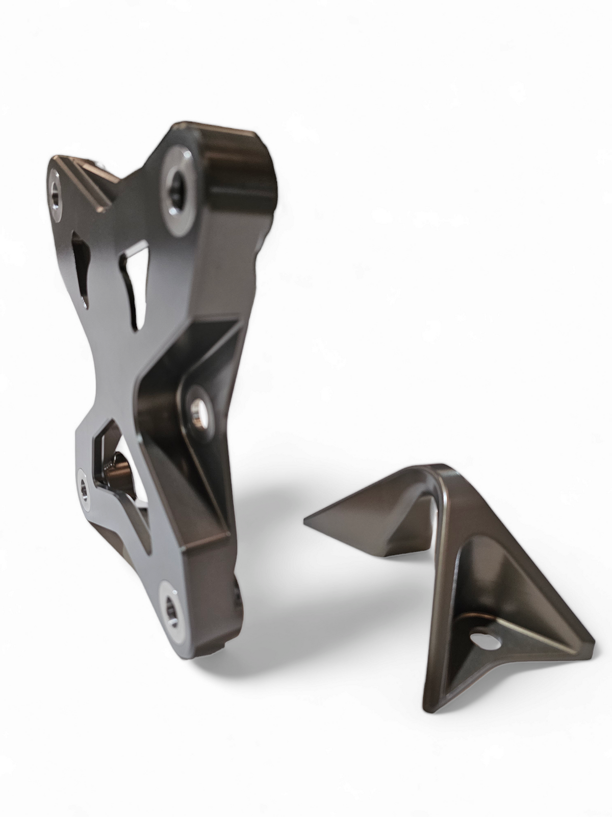 Gun metal anodized 6-bolt radius rod plate installed on Can-Am Maverick X3 protecting rear suspension heim joints