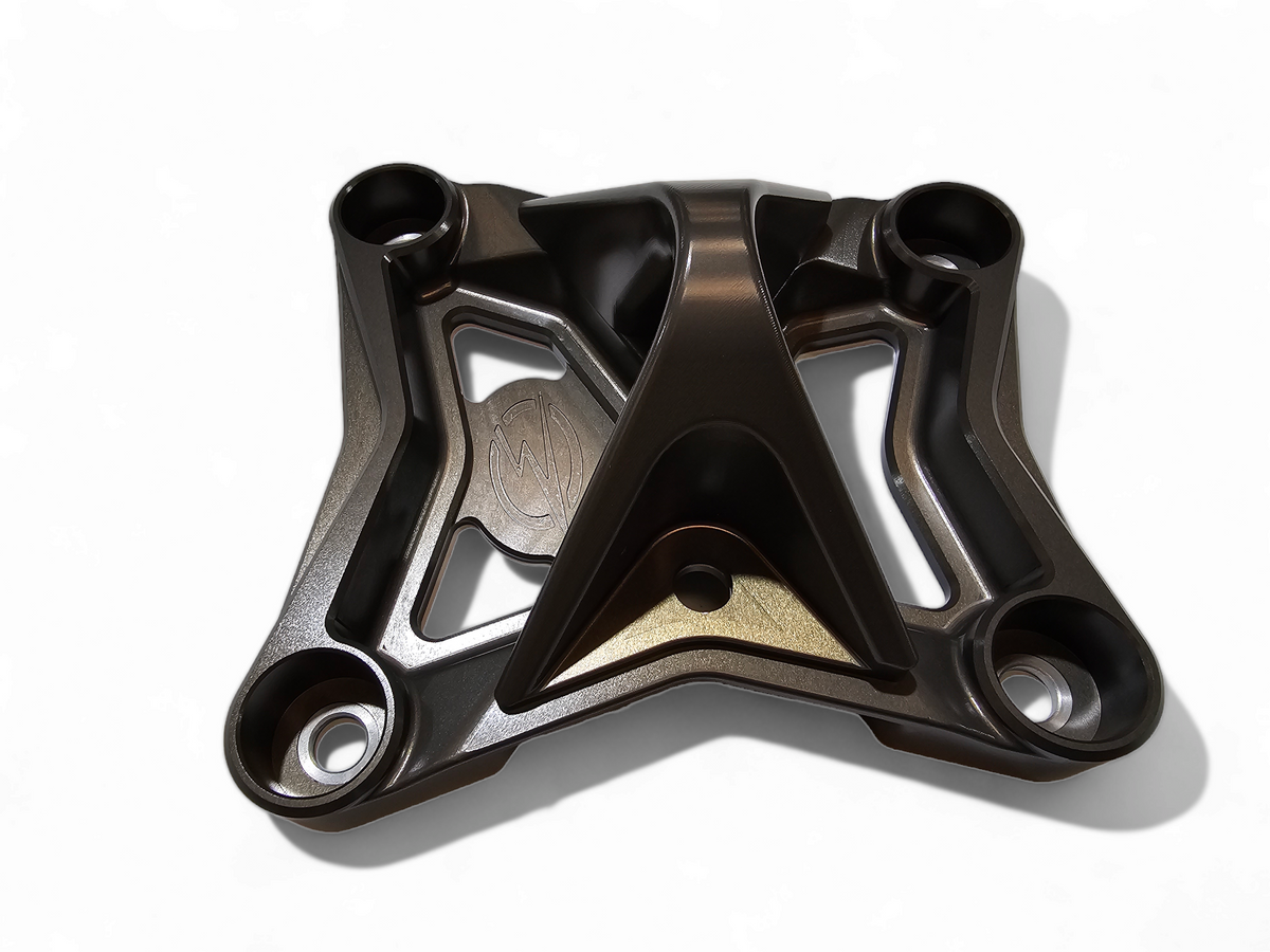 Stainless steel sleeve insert detail on Can-Am Maverick X3 gun metal radius rod plate