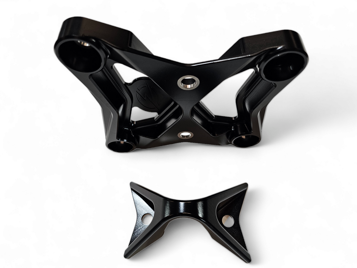 Built-in tow hook detail on Can-Am Maverick X3 black billet radius rod plate for recovery