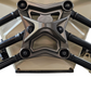 Side view of gun metal anodized Can-Am Maverick X3 6-bolt radius rod plate