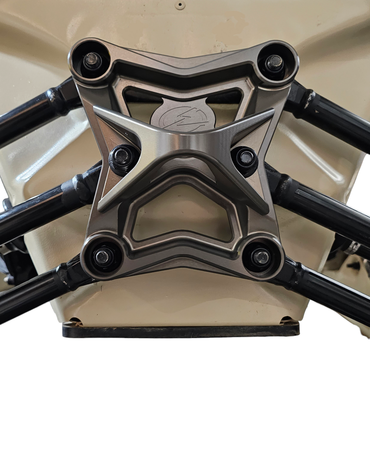 Side view of gun metal anodized Can-Am Maverick X3 6-bolt radius rod plate