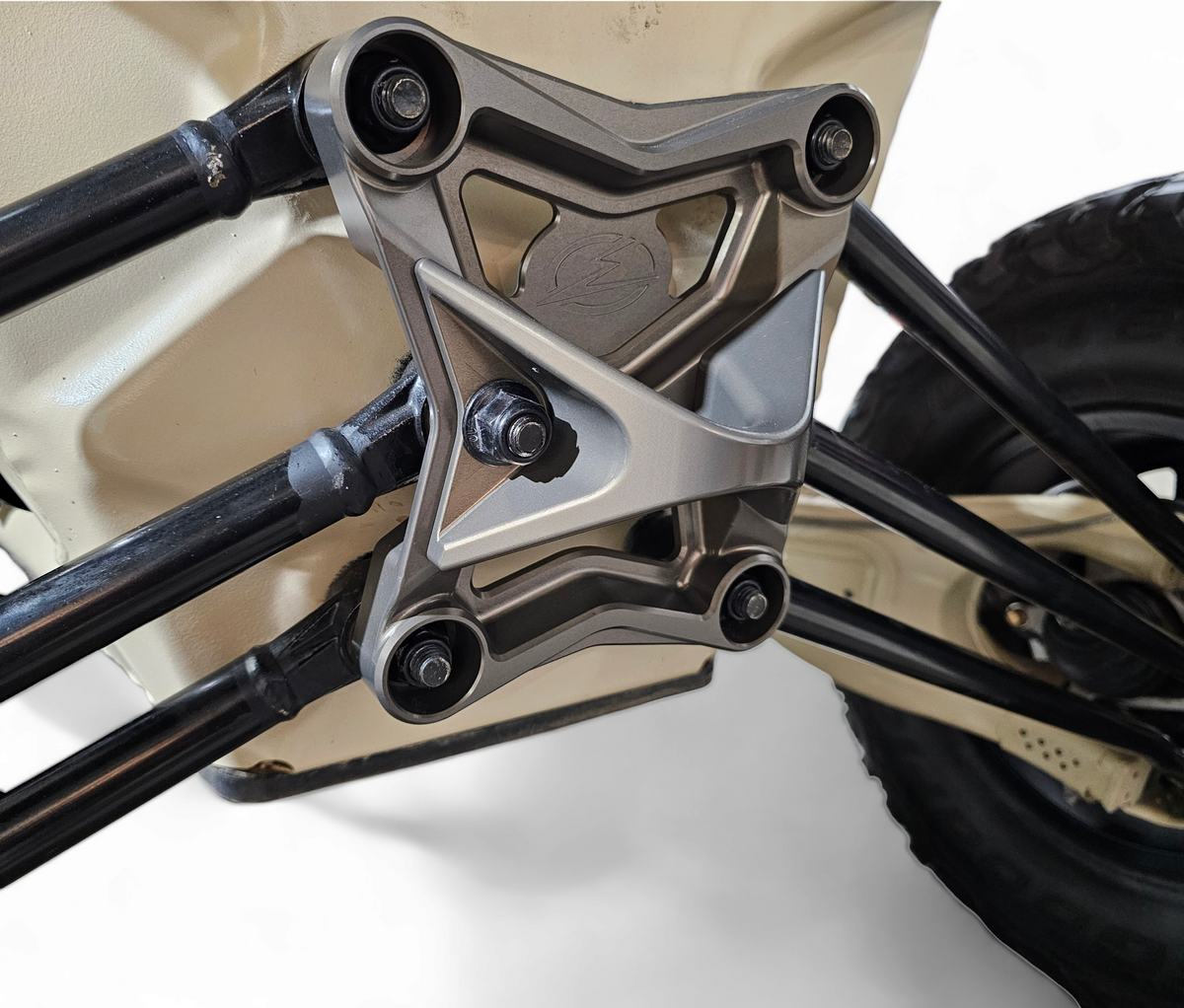 Tow hook recovery point detail on Can-Am Maverick X3 gun metal radius rod plate