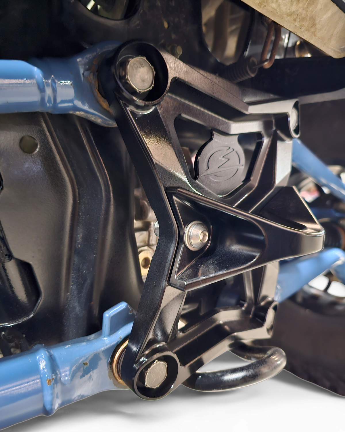 Polaris RZR Pro XP radius rod plate showing heim joint and rod bolt protection
