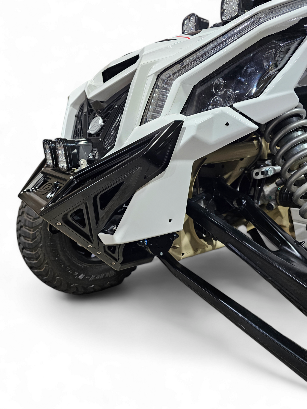 Bolt-on mounting point detail on black anodized Can-Am Maverick X3 billet front winch bumper showing factory frame attachment