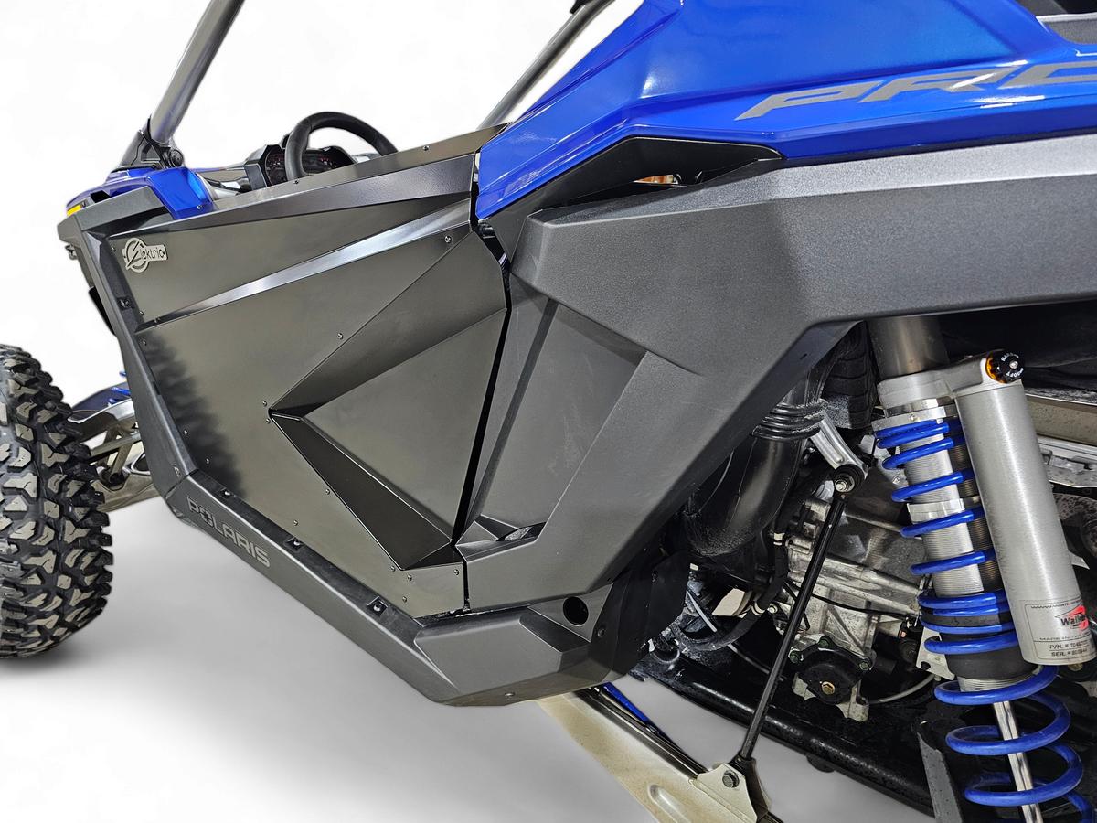 Side view of 2-seat Polaris RZR with Amp door skins installed