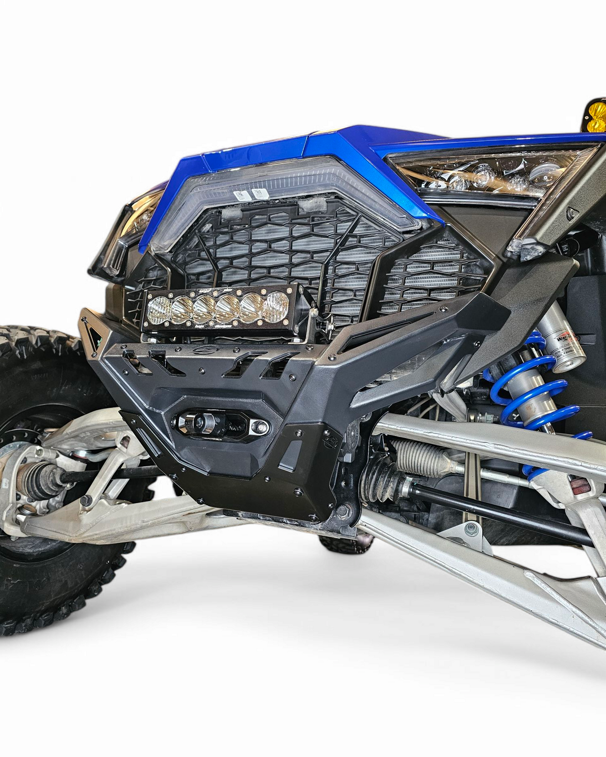 Side profile of Polaris RZR Pro R front bumper showing contour-hugging chassis fit