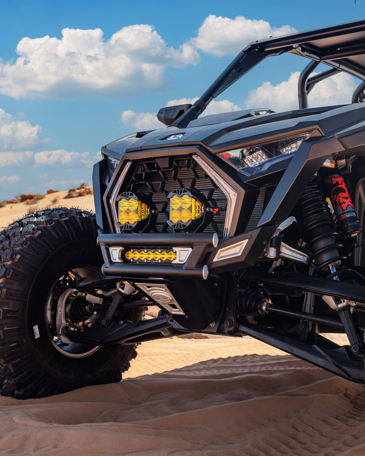 Amp Front Bumper installed on Polaris RZR Pro R showing dune