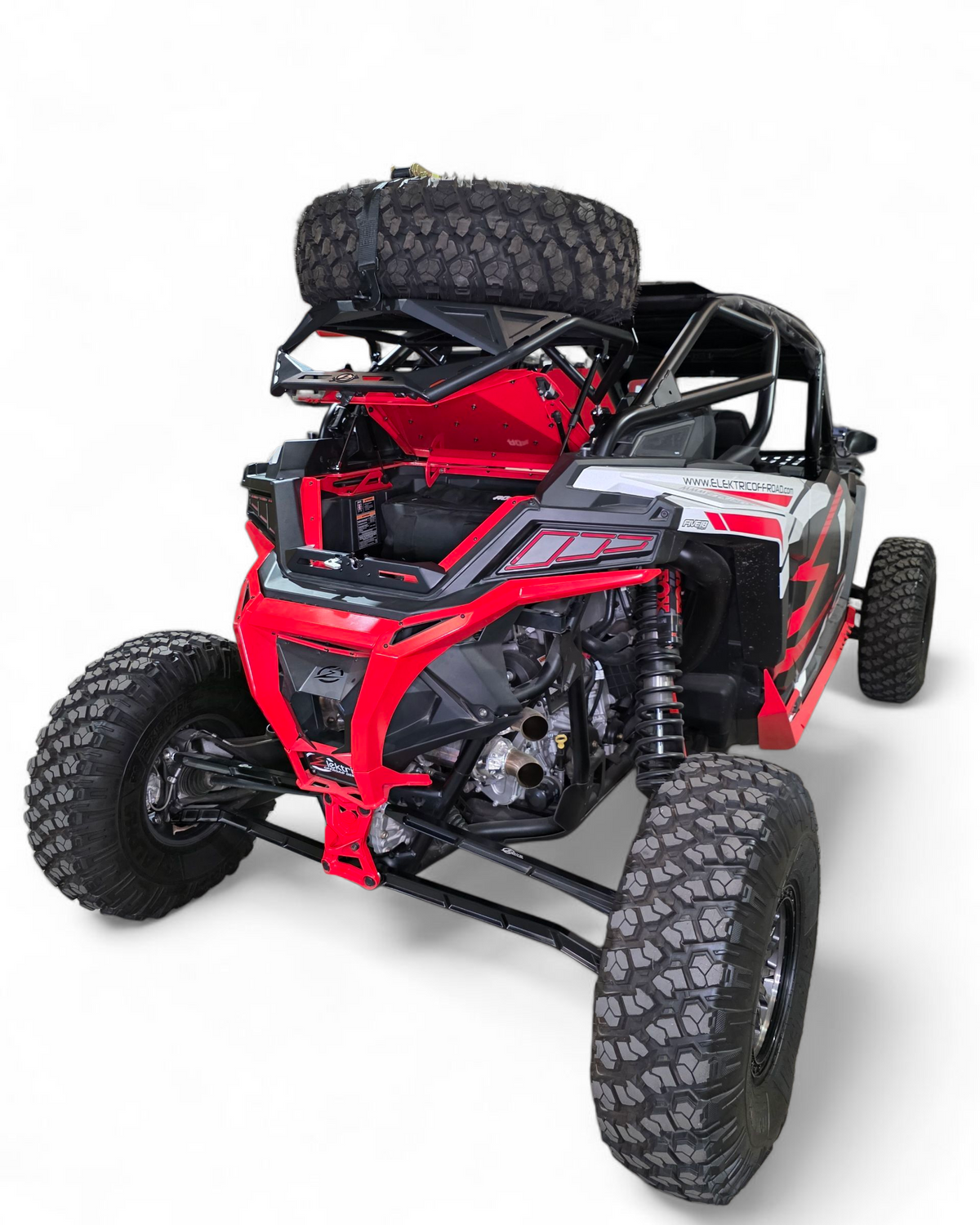 Rear three-quarter view of Polaris RZR high clearance tire rack with spare mounted