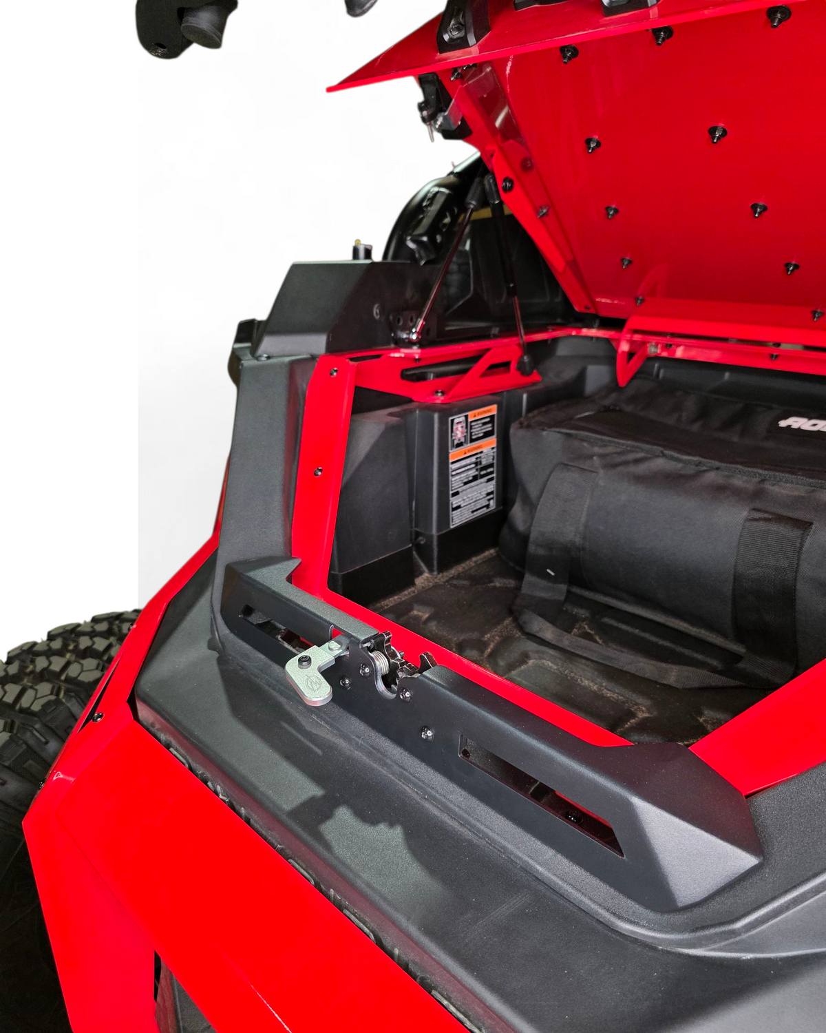 Polaris RZR tire rack shown carrying a cooler in place of a spare tire