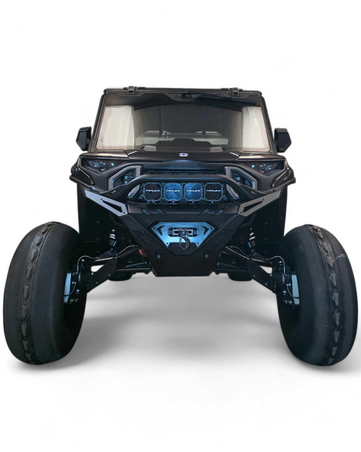 Light bar mounted on Polaris Ranger 1500 Volt front winch bumper showing forward lighting