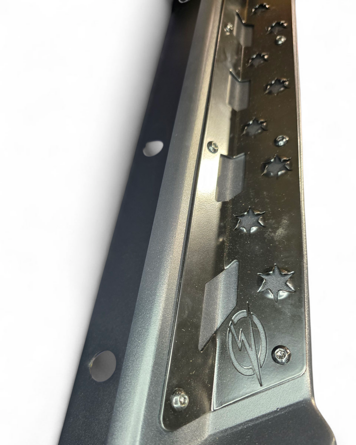 Polaris Xpedition Volt rock steps shown protecting the lower body on a tight trail