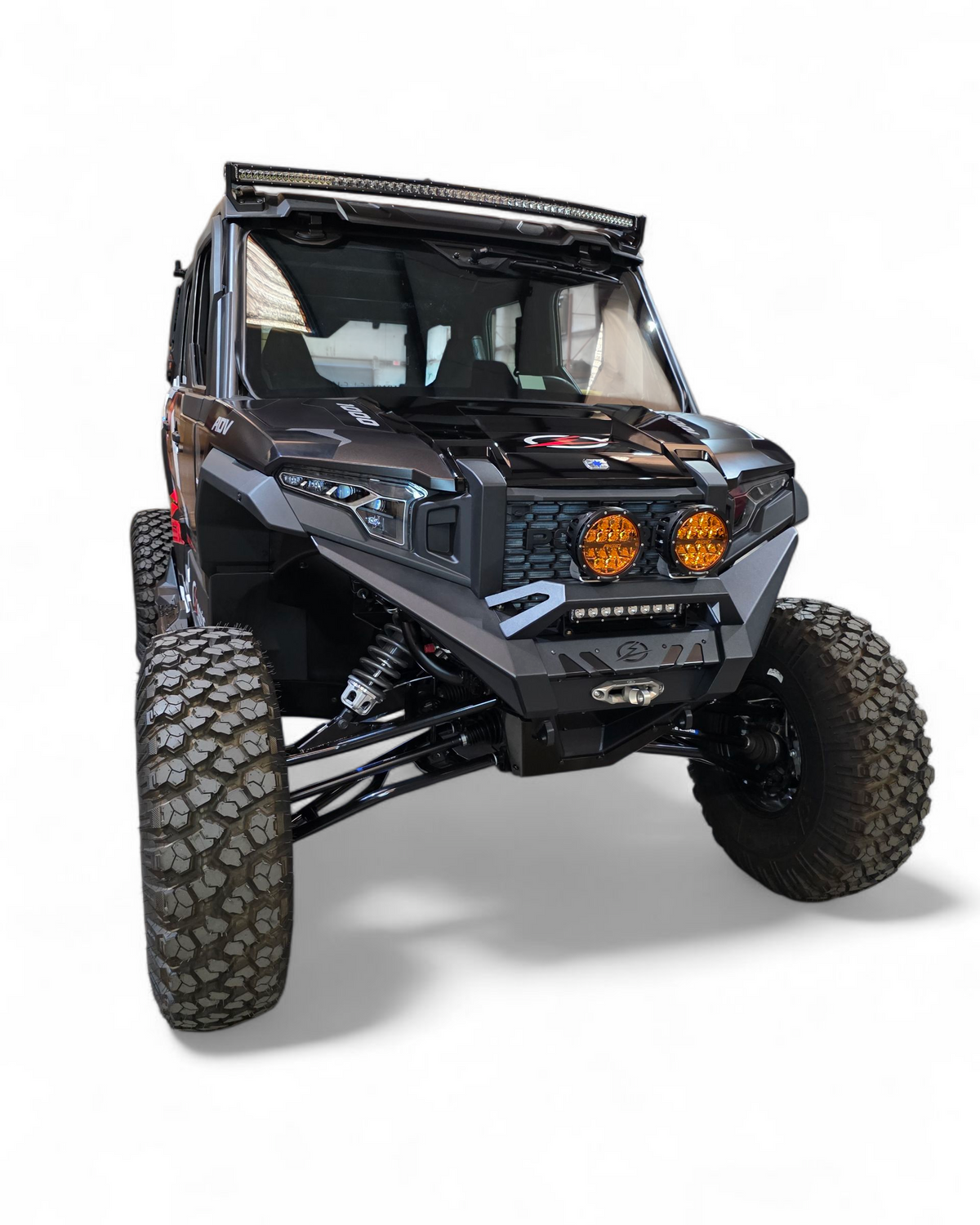 Front three-quarter view of Polaris Xpedition HDX Front Winch Bumper showing aggressive profile and satin black panels
